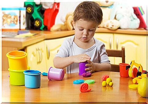 child playing plasticine