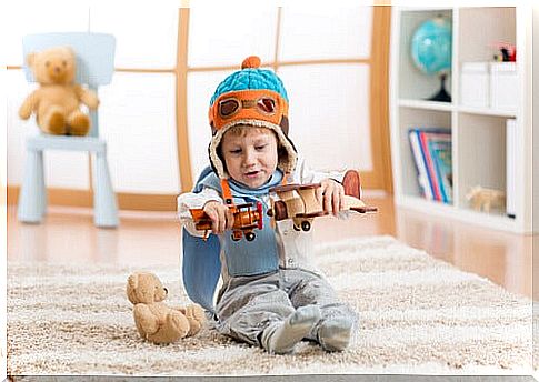 child playing with airplanes