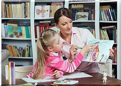 Psychologist-and-girl-analyzing-drawing