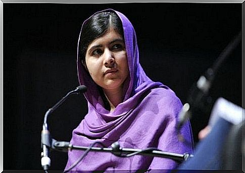 Malala Yousafzai at the microphone