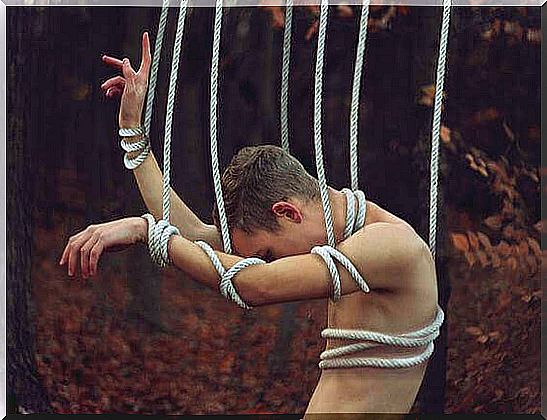 Man-tied-by-ropes