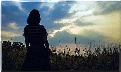 woman in a field after a trauma