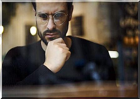 A man in reflective glasses.