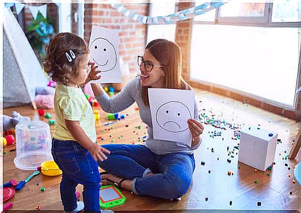 A mother showing drawings to her daughter. 