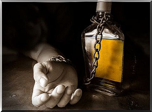 hand-chained-to-a-bottle-of-alcohol