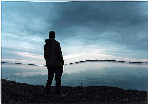 Sad man facing the sea suffering from untreated depression